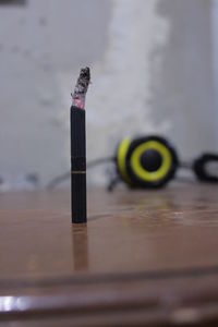 Close-up of cigarette on table