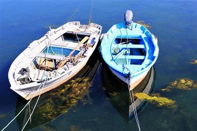 High angle view of sailboats moored in sea