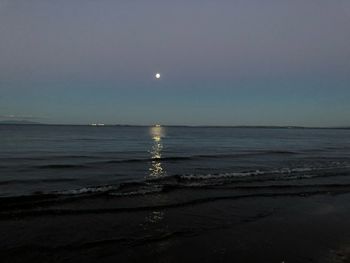 Scenic view of sea against sky at sunset