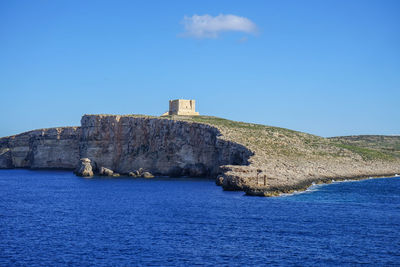 Scenic view of sea against blue sky