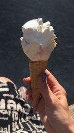 Midsection of woman holding ice cream