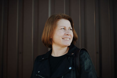 Close up portrait of a woman with wind in her hair .