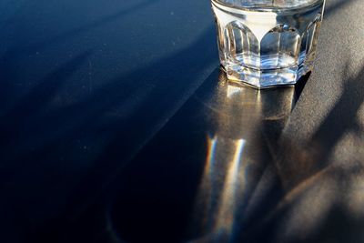 High angle view of drinking glass on table