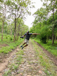 Man jumping on footpath