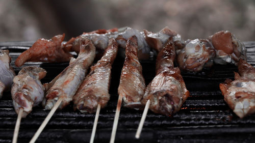 Close-up of meat on barbecue grill