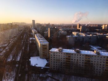 High angle view of buildings against sky during sunset