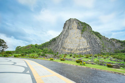 Road amidst rocks against sky