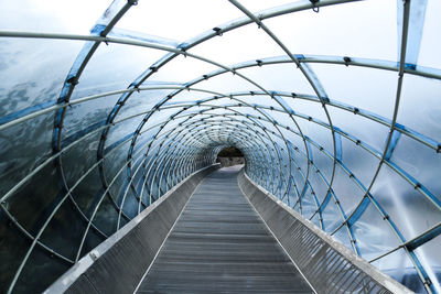 Footbridge against sky