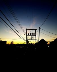 Silhouette electricity pylon against sky during sunset