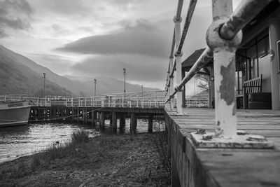 Pier over lake against sky