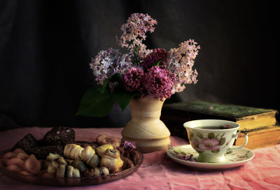 Close-up of flower vase on table