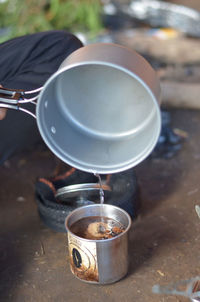 High angle view of coffee cup on barbecue grill