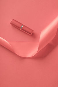 High angle view of beauty products on pink background