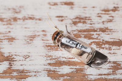 Close-up of information sign on table