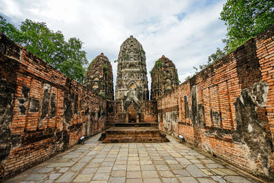 View of old temple building against sky