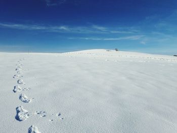 Scenic view of french snowing mountain against blue sky