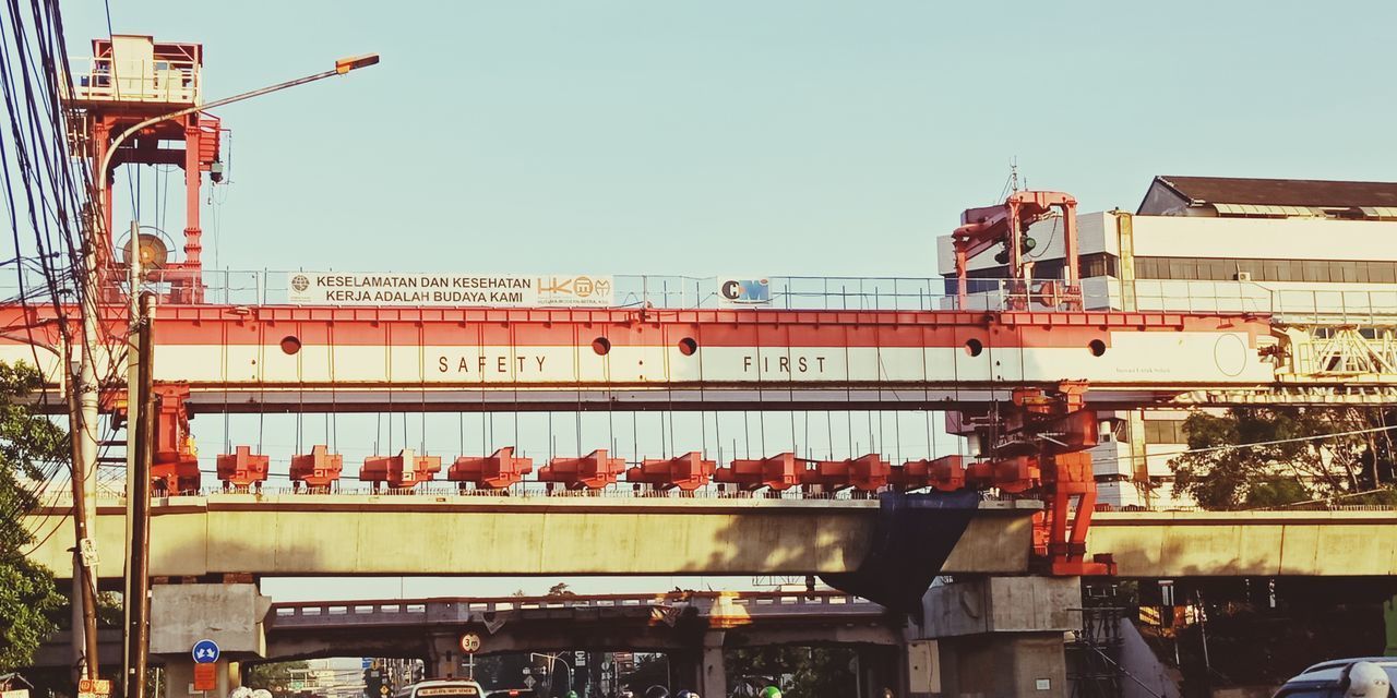 LOW ANGLE VIEW OF CONSTRUCTION SITE AGAINST BUILDING