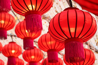 Low angle view of illuminated lanterns hanging at ceiling