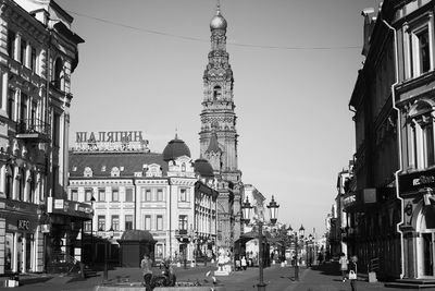 View of city street and buildings against sky