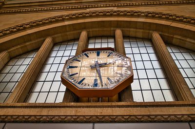 Low angle view of clock tower at railroad station building