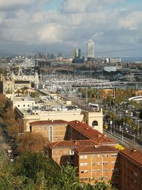 High angle view of buildings in city against sky