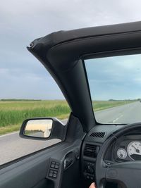 Cars on road seen through car windshield