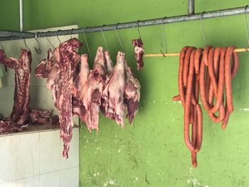 Clothes drying on display at market stall