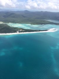 Aerial view of landscape and sea against sky