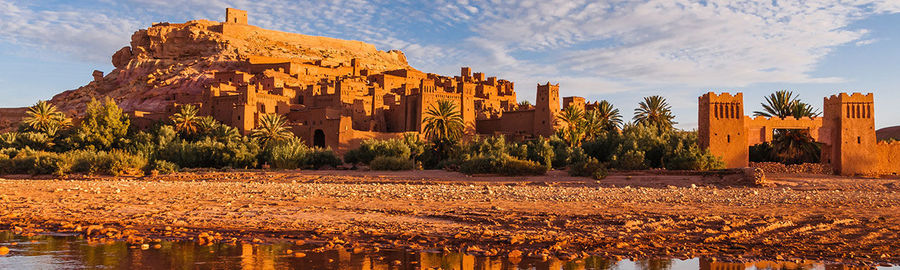 Panoramic view of buildings and rock formations against sky