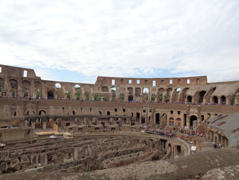 View of old ruins against cloudy sky