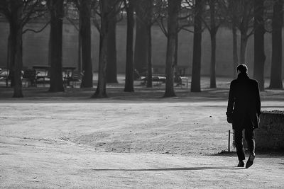 Rear view of a man with umbrella