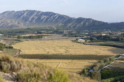 High angle view of field against mountains