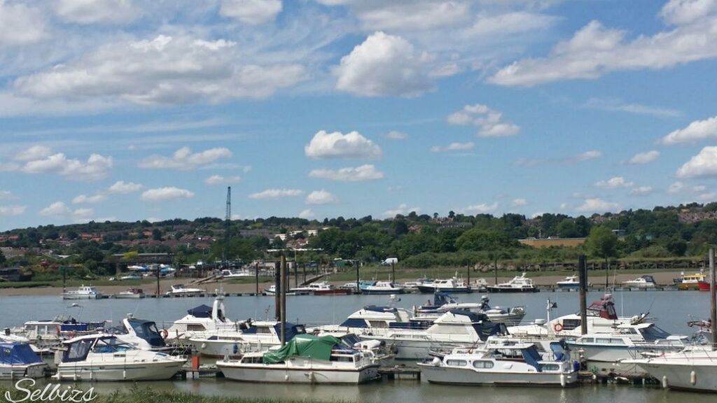 nautical vessel, moored, water, boat, transportation, sky, mode of transport, harbor, cloud - sky, tree, cloud, lake, sailboat, river, mast, cloudy, marina, sea, nature, day