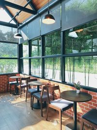 Empty chairs and tables in restaurant