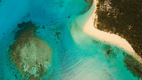 Aerial view of beautiful tropical island daco with white sand beach.