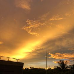 Low angle view of silhouette trees against sky during sunset