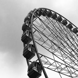 Low angle view of ferris wheel against sky