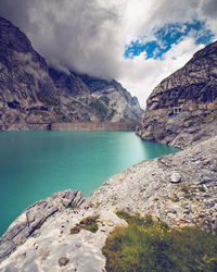 Scenic view of lake and mountains against sky