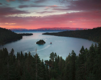 Scenic view of lake against sky at sunset