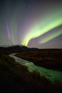 Scenic view of mountain against sky at night