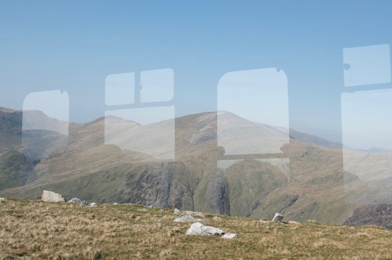 sky, mountain, scenics - nature, tranquil scene, beauty in nature, landscape, tranquility, no people, day, nature, environment, non-urban scene, land, grass, outdoors, idyllic, mountain range, plant, field, copy space, mountain peak