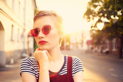 Portrait of young woman in sunglasses