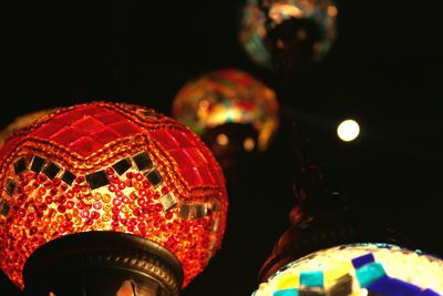 Low angle view of lanterns hanging at night
