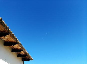 Low angle view of built structure against clear blue sky