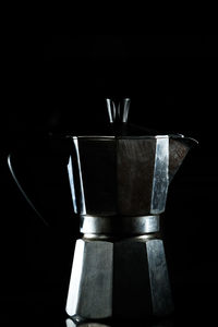 Close-up of coffee cup against black background