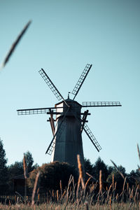 Traditional windmill against clear sky