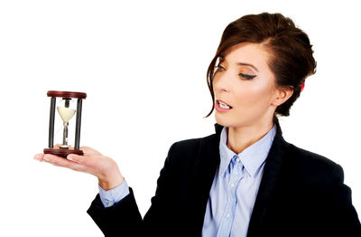 Young woman looking away against white background