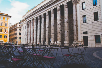 Temple of hadrian, piazza di pietra in rome. wide angle view of the ancient marble columns.