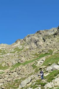 Scenic view of mountains against clear blue sky