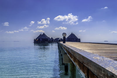 Pier over sea against sky